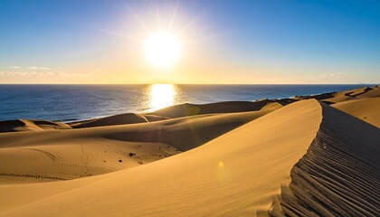 Golden dunes meet a vibrant sunset over the ocean