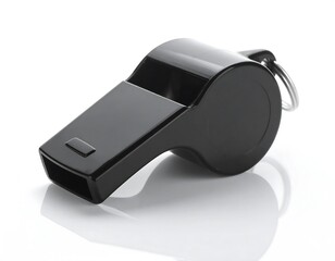 A black plastic whistle sits on a white background, reflecting its shape and form.