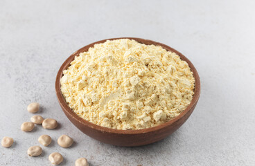Lupines flour in a wooden bowl on a gray background. Gluten-free, protein-rich food. 
