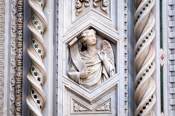 high relief of an angel detail of the facade of the cathedral Santa Maria del Fiore in Florence