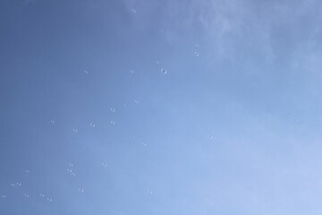 blue sky with clouds and soap bubble