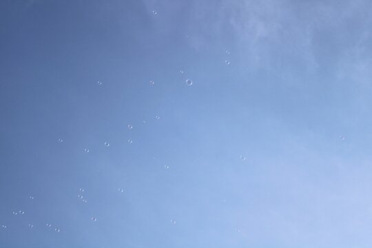blue sky with clouds and soap bubble - Powered by Adobe