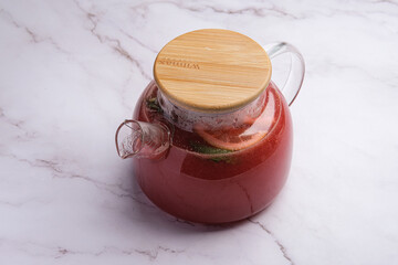 Delightful and Refreshing Hibiscus Tea Served in a Stylish Glass