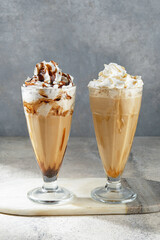 Indulge in some delicious iced coffee drinks topped with whipped