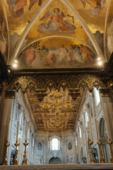 Archbasilica of Saint John Lateran interior Rome golden coffered ceiling marble columns statues ornate chapels baptistery and apse Catholic basilica Italy. High quality photo © Thao