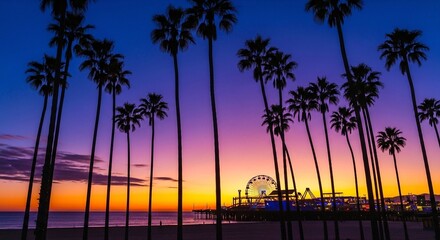 Colorful purple and orange sunset over the santa monica pier. Silhouetted palm trees frame the beach scene. Ferris wheel and fairground rides light up as dusk settles, creating a serene, dreamy