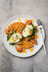 Savory Waffles with perfectly Poached Eggs and an array of