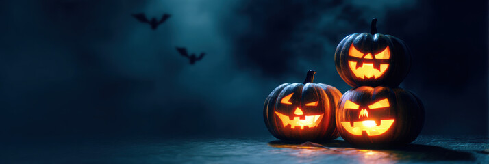 Three illuminated jack-o'-lanterns on a dark Halloween night.