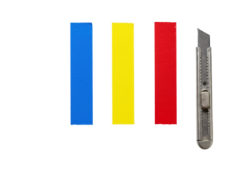 Vibrant blue, yellow, red duct tape strips and a silver utility knife blade, precisely arranged on a transparent background with copy space, clean product display concept