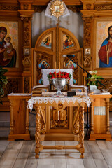 Eastern Orthodox Church Altar with Red Roses and Icons, Wooden Interior, Religious Ceremony, Golden Accents, Detailed Carvings, Spiritual Scene