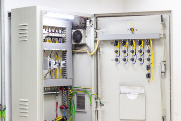 Open Electrical Control Panel with Detailed Wiring and Components Showcase electrical distribution and management in a modern power system energy infrastructure inside view