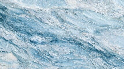 Obraz premium This surface features stunning blue marble with graceful wave patterns and soft gradients, illuminated beautifully in natural light. Its intricate design evokes a serene atmosphere.