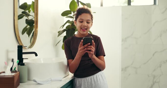 Typing, social media and girl in bathroom with phone, smile or COPPA for text. Child, online safety and privacy in home for engagement, digital literacy and avoid screen time restriction with message