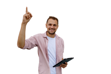 Young man pointing up holding a tablet, having an idea or showing inspiration with a happy expression