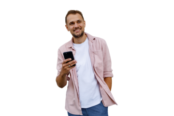 Young man smiling, holding smartphone in hand, checking mobile app, connecting to wireless internet