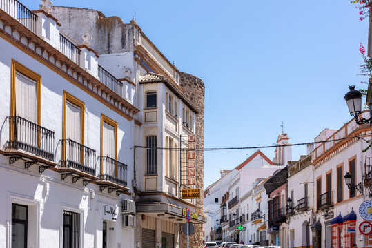 Marchena, Andalusia, Spain. 4 September 2025. Traditional street with historic buildings and shop signs