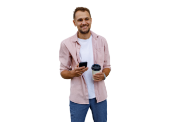 Young man smiling, holding smartphone and coffee cup, using mobile app, enjoying break time, transparent background