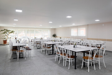 A Modern Dining Hall Featuring a Spacious Layout with an Elegant and Inviting Design