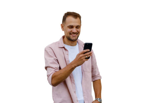 Happy man using smartphone, browsing social media, texting, and smiling, enjoying online communication