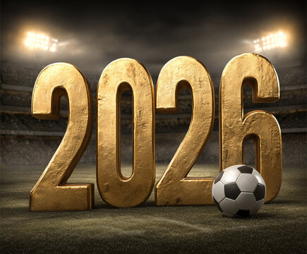 Wielkie, złote cyfry "2026" stoją na boisku piłkarskim, obok nich leży piłka. W tle widać oświetlony stadion.