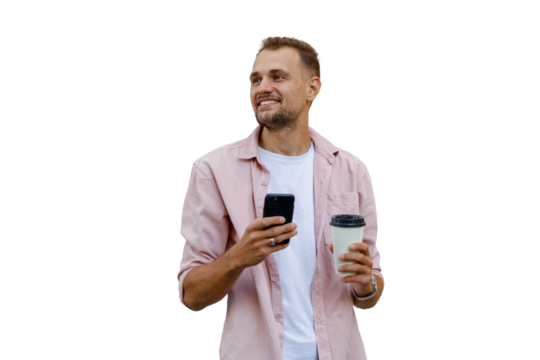 Young man holding smartphone and coffee cup, smiling and looking away, casual style, connecting and relaxing