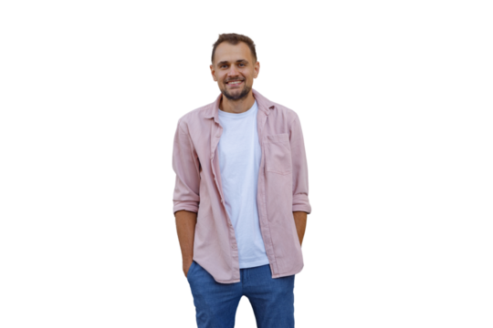Smiling man in pink shirt and jeans, standing with hands in pockets, posing for portrait, transparent background