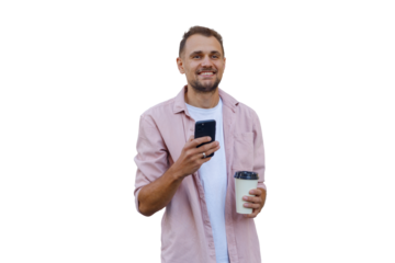Happy young man holding smartphone and coffee cup, smiling and communicating, enjoying digital lifestyle