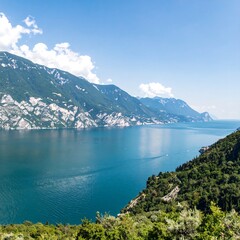 Panoramic view of a serene lake nestled amongst mountains