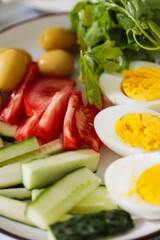 Healthy Breakfast Plate with Tomato Cucumber Egg and Olives