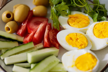 Healthy Breakfast Plate with Tomato Cucumber Egg and Olives