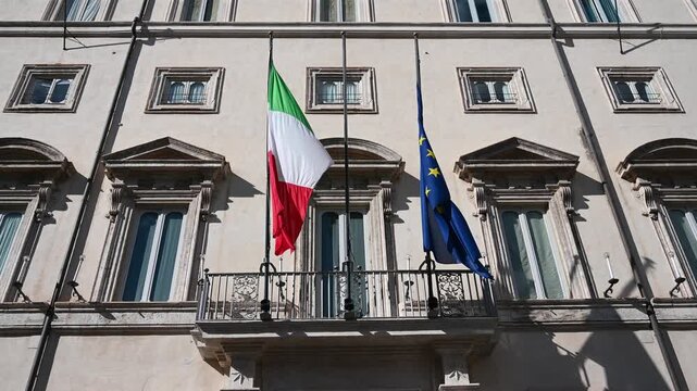 Rome, Italy: Flags of Italy and European union. Chigi Palace is the seat of the Council of Ministers and the official residence of the Prime Minister of Italy. Italian government institutions. 