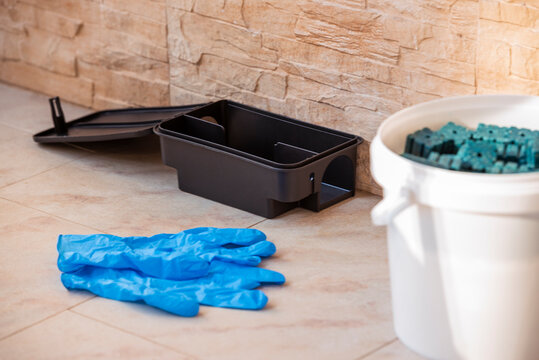 Pest control bait station with rodenticide and safety gloves