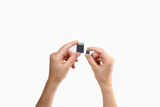 Minimal tech composition with SD and microSD in hands ideal for software companies, tech tutorial creators, app developers, cloud service providers, data recovery firms