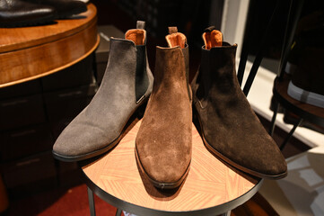 Women's leather shoes for sale in store. Shoes in the shop window. Female shoes and boots. 