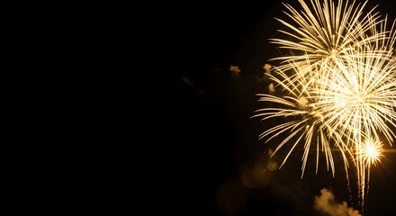Golden Fireworks Explosion on Black Night Sky Background.
