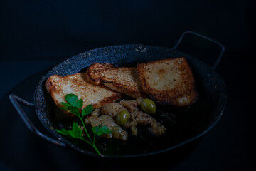 Toasted bread with olives and pickled eggplant