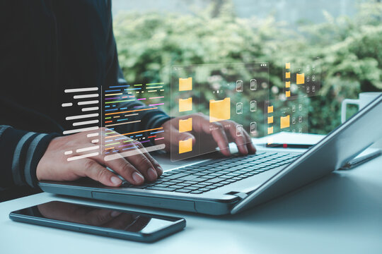 Programmer working on laptop with digital code and virtual file folders, representing software development, data management, cloud storage and modern information technology solutions. - Powered by Adobe