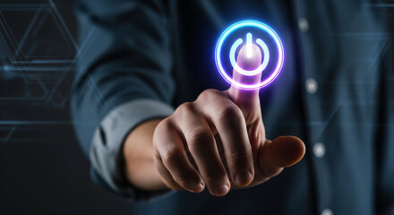 Hand pressing glowing power button on futuristic interface, symbolizing activation and technology.