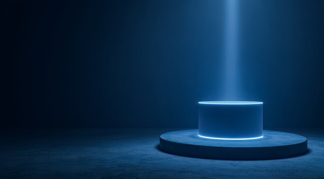 Blue light is shining on a pedestal. The pedestal is white and has a blue glow