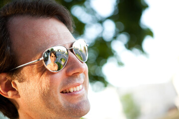 Bride Reflected in Happy Groom's Sunglasses
