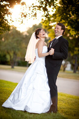 Happy Bride and Groom Slow Dancing and Laughing Together Outside - Romantic Wedding Moment 