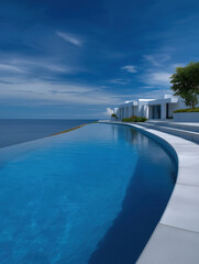 Fototapeta premium Infinity pool overlooking the ocean under a clear blue sky