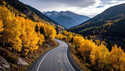 Fototapeta premium Curving Road Through Autumnal Mountain Valley