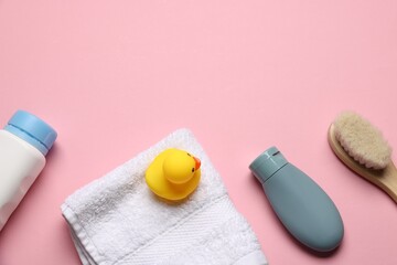 Baby bath accessories and cosmetic products on pink background, flat lay. Space for text
