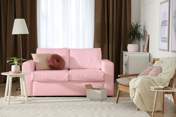 Living room with pink sofa and other furniture. Interior design