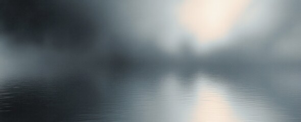 Calm and misty lake with soft reflections of light and silhouetted trees in the distance creating a peaceful and serene atmosphere
