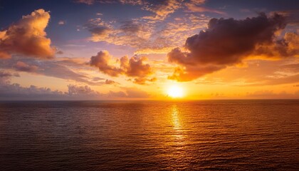 Fototapeta premium Sunset Sky Clouds Over Sea In The Evening With Orange Yellow Gold Sunlight Sun Dawn In Golden Hour And Dramatic Fluffy Horizon Morning Sunny Sunrise Sea Summer Sky Landscape Dusk Sky Background