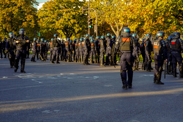 french anti riot police squad and Gendarmerie  marching during a strike