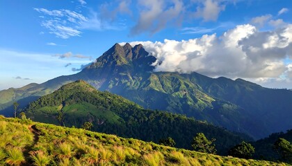 Fototapeta premium Majestic Mountain Range Under a Cloud-Kissed Sky