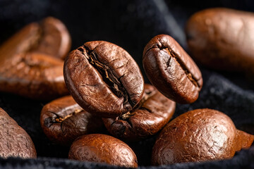 Close-up of roasted coffee beans, rich texture and aroma, perfect for coffee and lifestyle themes.